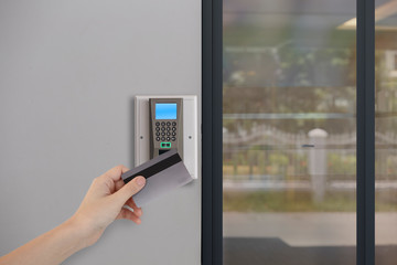 Holding Key Card and Tap On Digital Door Locked Machine For Access Door Security Systems,
