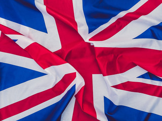 Waving national Flag of the United Kingdom. Top view close-up. Congratulations to loved ones, family, relatives, friends and colleagues
