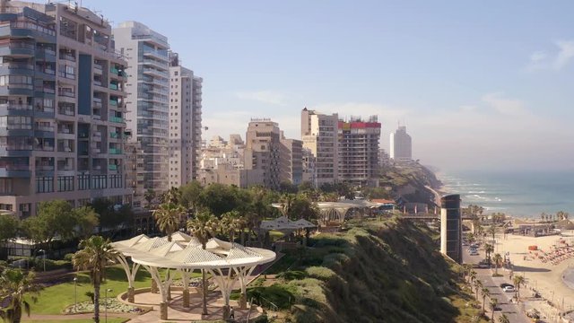 Flying above Natanya promenade area, Israel, 4k drone aerial skyline view 