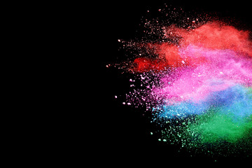 Abstract powder splatted background. Colorful powder explosion on black background. Colored cloud. Colorful dust explode. Paint Holi.