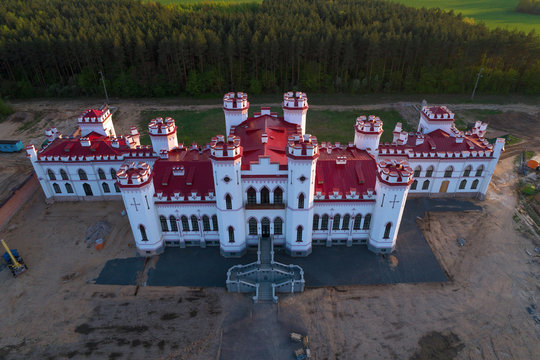 Renovated ancient old castle-palace of Puslovsky close up on April evening (aerial photography). Kossovo, Belarus