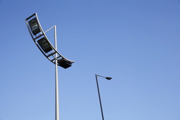 Obraz premium Modern street lamp in blue sky.