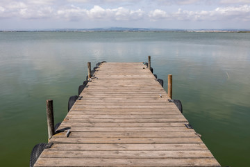 Fototapeta premium A Dock By The Lake At morning Sky
