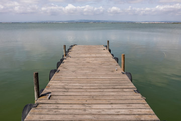 A Dock By The Lake At morning Sky