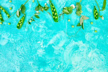 Fototapeta na wymiar Flat lay composition with delicious fresh green peas on blue background. Vegan and vegetarian food concept.