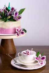 Delicious cake with fresh flowers