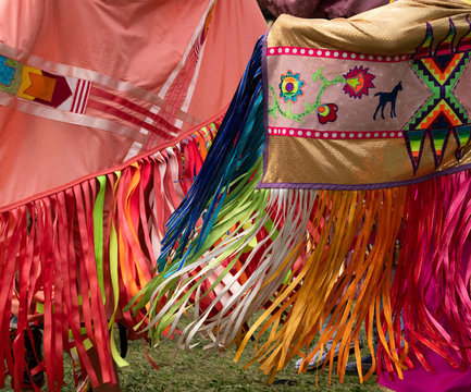 Women Dancing with Colorful Shawls at a Pow Wow