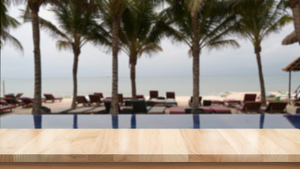 Wood table top and blurred summer beach background