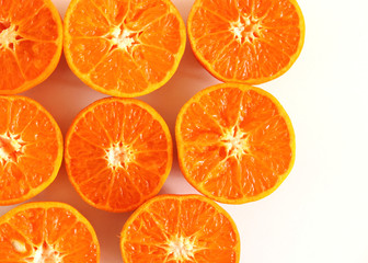 Tropical exotic fruit . Tangerines slices isolated on white table background. Summer food concept. Flat lay, top view