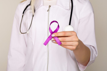 Female doctor in white uniform with purple awareness of ribbon in hand for ADD,ADHD,Alzheimer...