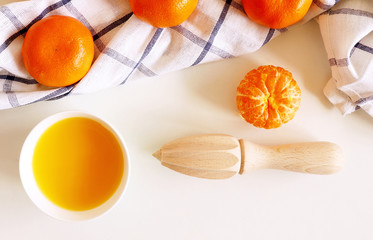 Set of fresh mandarins fruit .Whole and sliced mandarins on white wooden table.Material for juice for breakfast or for summer drink. Rich of nutritions, fiber, and vitamins.