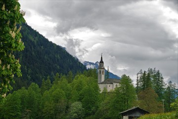 Bautiful church on top of a hill in the forst.