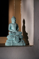 the buddha statue and shadow and shadow