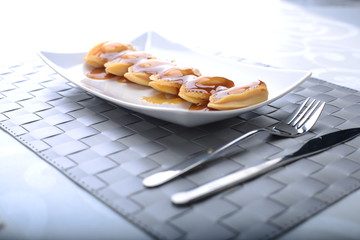wide spread of abalone servings in a fine dining setting