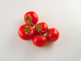 Red tomatoes fresh harvest on a white background