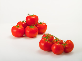 Red tomatoes fresh harvest on a white background