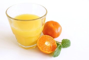 Tangerines and juice glass isolated on white background. Summer food concept.