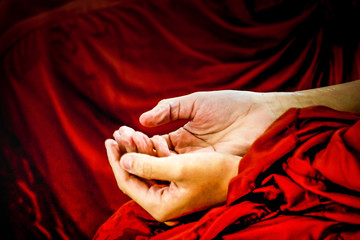 Monk wrinkled hand because of soak in the water . Thailand traditional in New year.