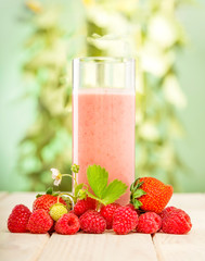 smoothie of berries on the table in the garden