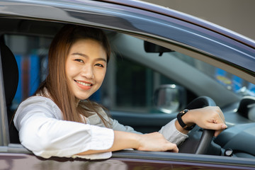 Beautiful attractive young woman smile in casual sitting in car,Diving car with confident and happiness feeling,Happy transport concept