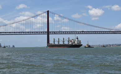 cargo under bridge in Lisbon, Portugal