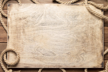 ship rope at wooden board background - 272217279