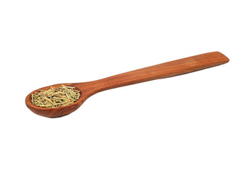 Dry rosemary in a spoon
