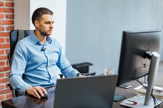 Programmer working in a software development company office. Website design.