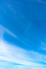 Naklejka na ściany i meble Cloudy blue sky. Blue backdrop in the air for text.