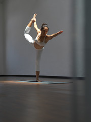 Fototapeta na wymiar Asian chinese single woman in white practising Yoga