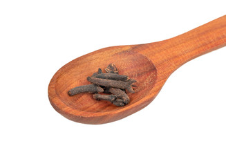 Dry cloves in spoon