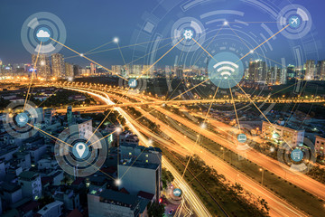 Smart city and wireless communication network concept. Digital network connection lines of Hanoi city at Thang Long multiple land highway at night