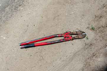 Top view old cutter for wire or steel bars on the land
