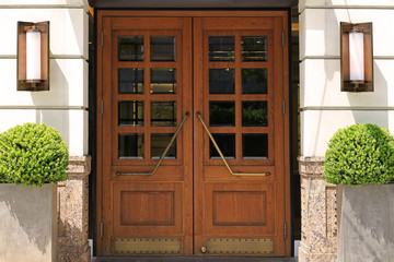 Double wooden door at the entrance of the building