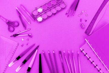 Colored school various stationery, paints, pencils, pens, on a yellow background. Back to school concept, top view, copy space