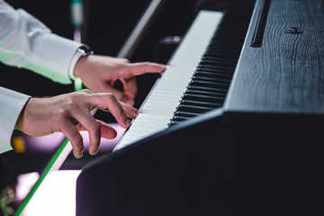 Man playing the keys close up
