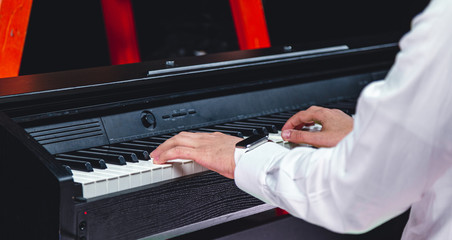 Man playing the keys close up
