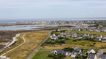 Aerial view of the coast and the small village of Saint-Pierre, Penmarch, Brittany, France, as seen...