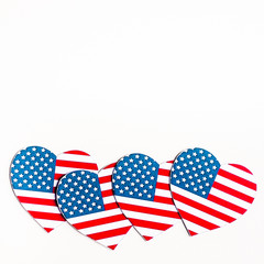 American Independence day background with blue, white and red mixed stars and hearts. Celebration of American independence day, the 4th of July (the Fourth of July). Holiday concept. With copy space. 