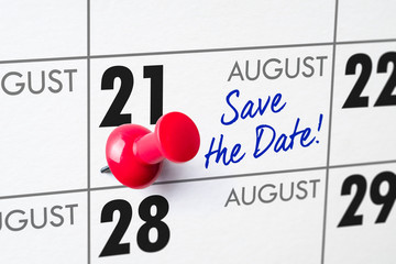 Wall calendar with a red pin - August 21