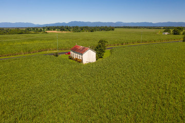 Aerial view of a church in the middle of a field