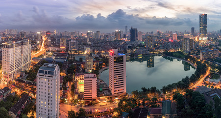 Fototapeta premium Hanoi city by twilight period, with Giang Vo lake, Ba Dinh district. Aerial skyline view.