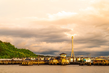 Kampong Ayer at sunset with Sungai Kbun bridge in the background
