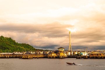 Kampong Ayer at sunset with Sungai Kbun bridge in the background
