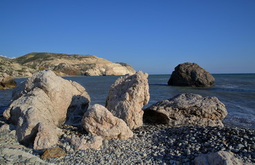 Beautiful coastline of Cyprus, rocks, blue Mediterranean sea water, arid hill, 