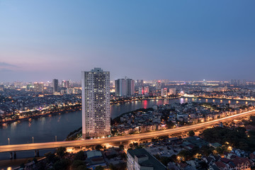 Obraz premium Aerial skyline view of Hanoi at Linh Dam lake, Belt Road No. 3. Hanoi cityscape by sunset period