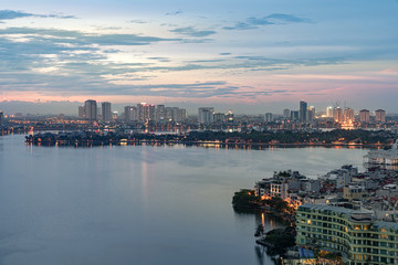Naklejka premium Aerial view of Hanoi skyline at West Lake or Ho Tay. Hanoi cityscape at twilight