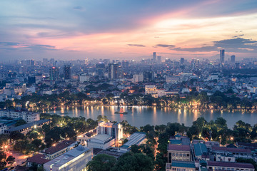 Aerial skyline view of Hoan Kiem lake or Ho Guom, Sword lake area at twilight. Hoan Kiem is center of Hanoi city. Hanoi cityscape.