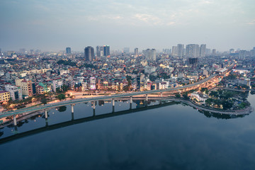 Obraz premium Aerial skyline view of Hanoi city, Vietnam. Hanoi cityscape by sunset period at Hoang Cau lake, Dong Da district
