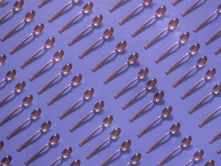Spoons pattern on purple background